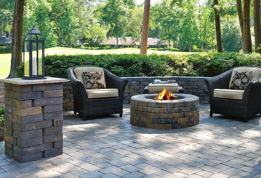 big patio with chairs and fire pit